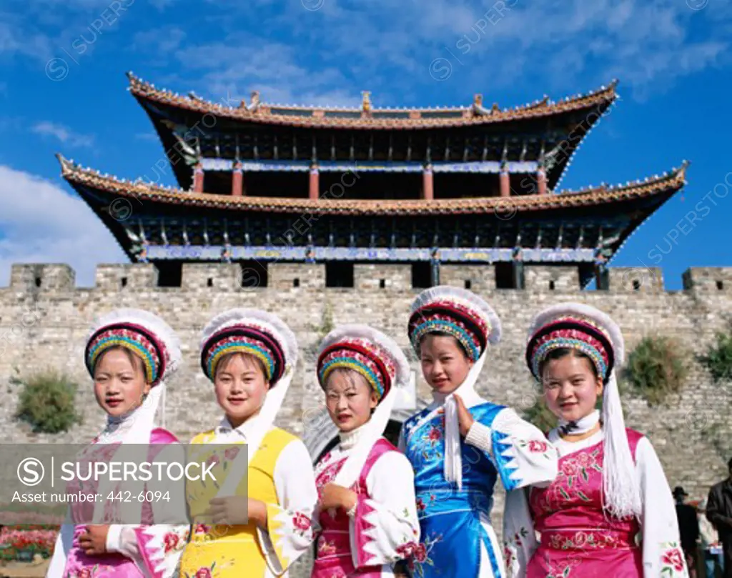 Group of women dressed in Bai traditional costumes, Old Town Gateway, Old Town, Dali, China
