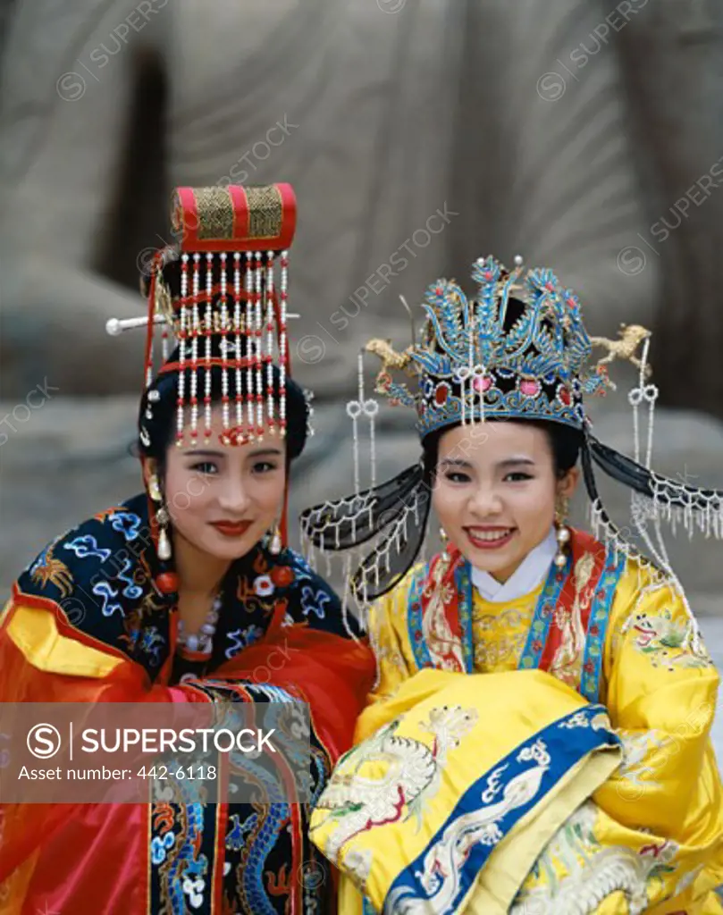 Portrait of two women dressed in traditional costumes, Beijing, China
