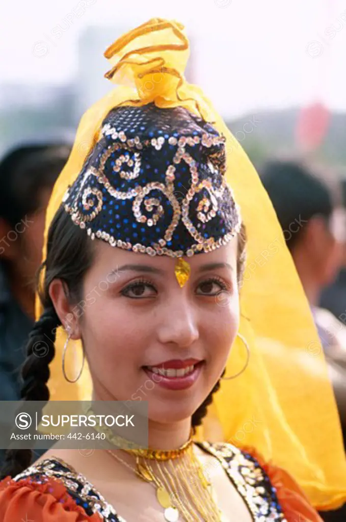 Portrait of a young woman dressed in a Uigur costume, Urumqi, China