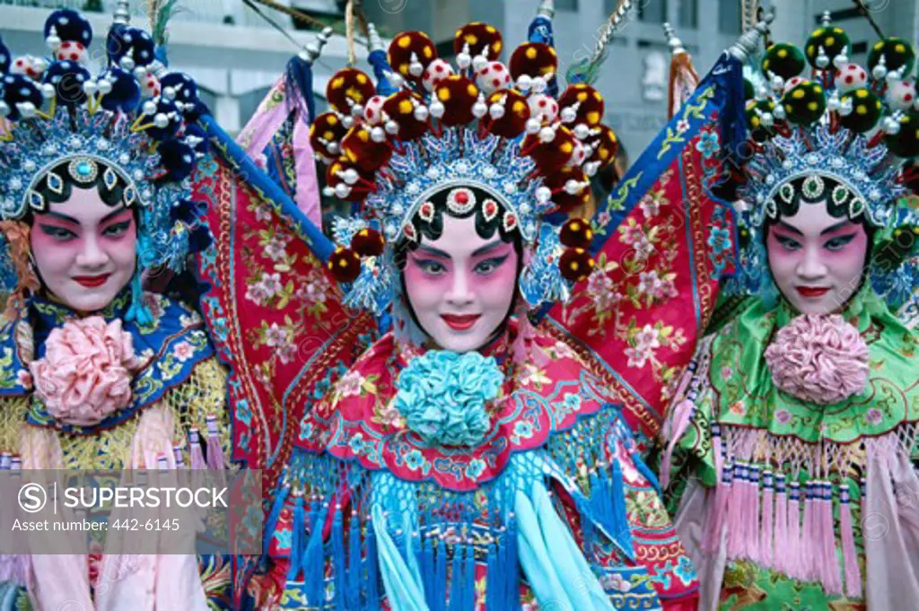 Portrait of three Beijing opera performers dressed in costumes, Beijing, China