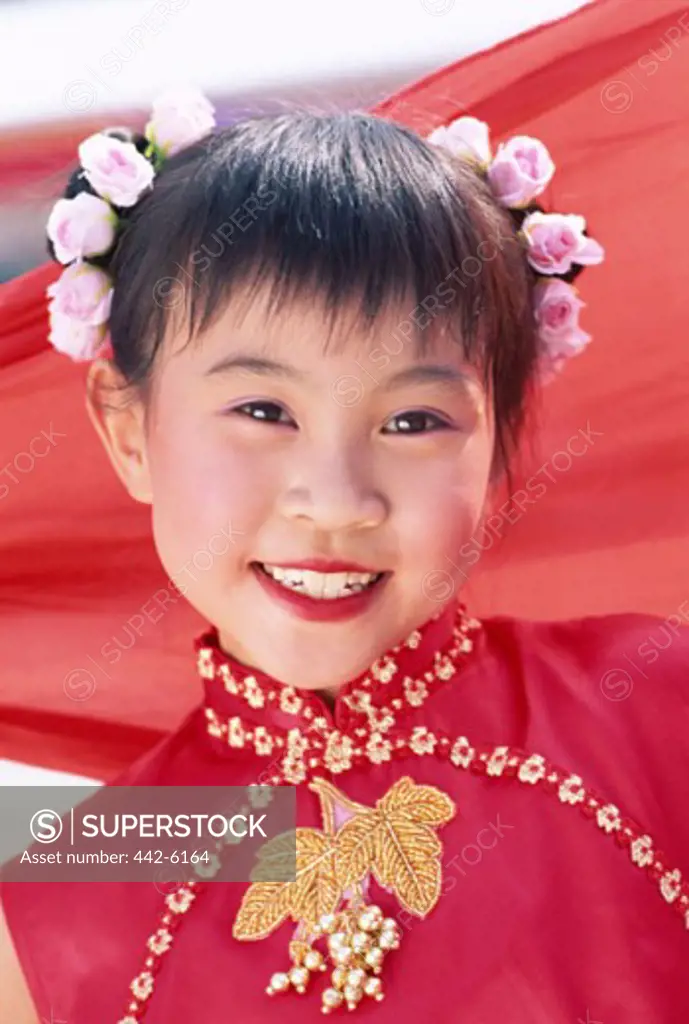 Portrait of a girl dressed in a traditional Cheongsam Chinese dress, Beijing, China