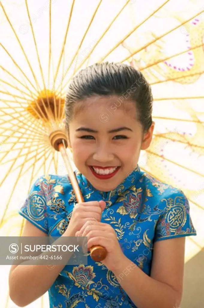 Portrait of a girl dressed in a traditional Cheongsam Chinese dress, Beijing, China