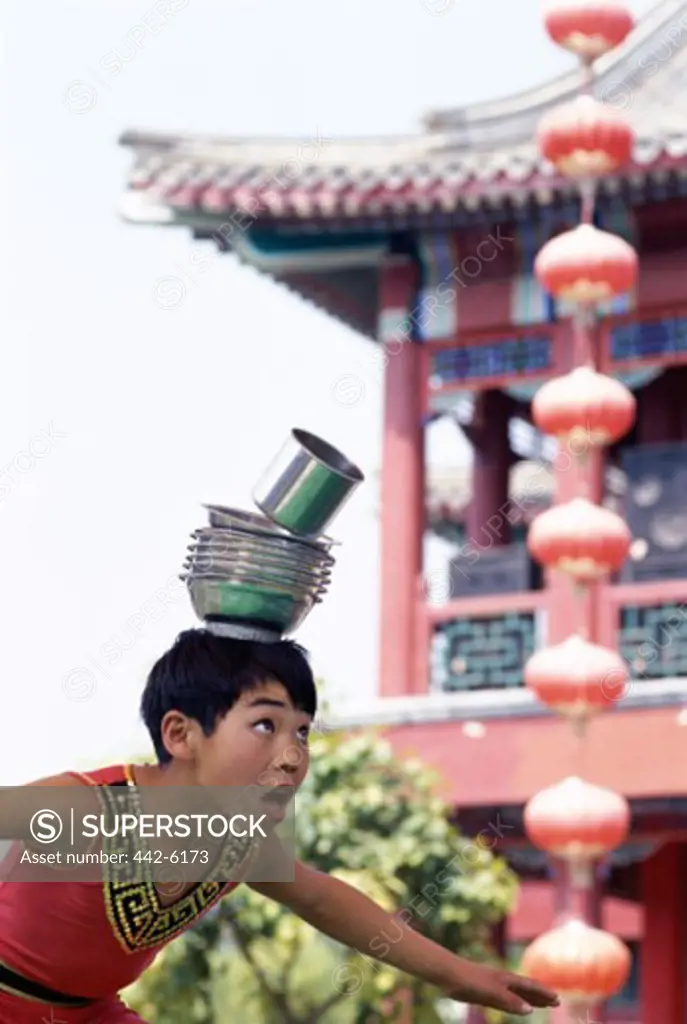 Boy performing acrobatics, Shanghai, China