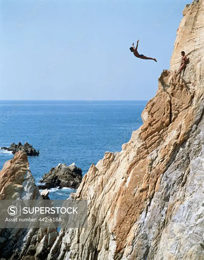 Man diving off a cliff, La Quebrada, Acapulco, Guerrero, Mexico