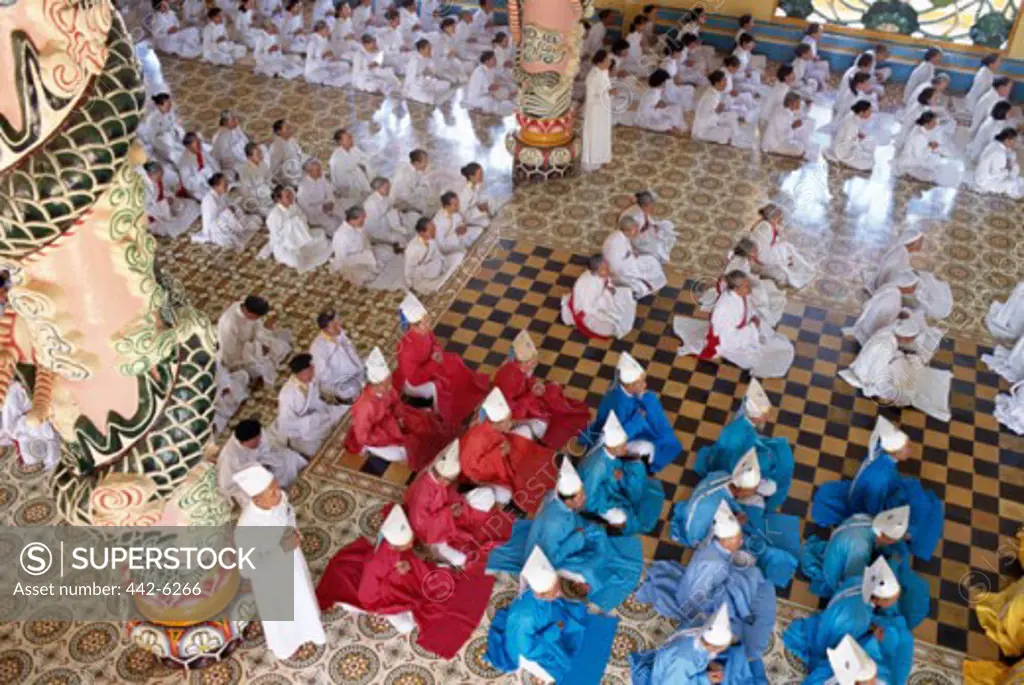 High angle view of worshippers in a temple, Cao Dai Great Temple, Tay Ninh, Vietnam