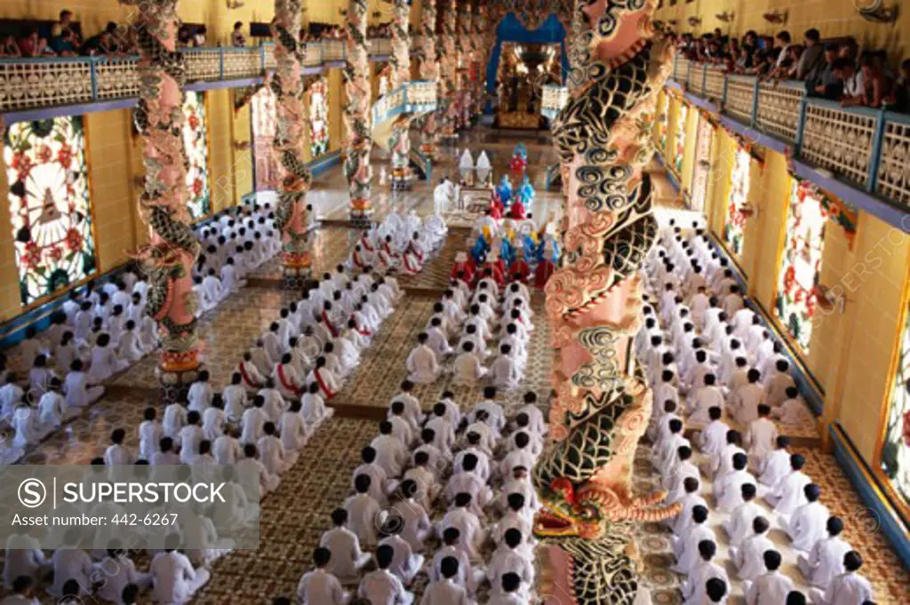 High angle view of worshippers in a temple, Cao Dai Great Temple, Tay Ninh, Vietnam