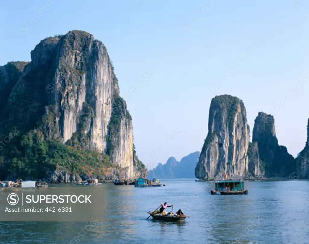 Houseboats on water, Karst Limestone Rocks, Ha Long Bay, Vietnam