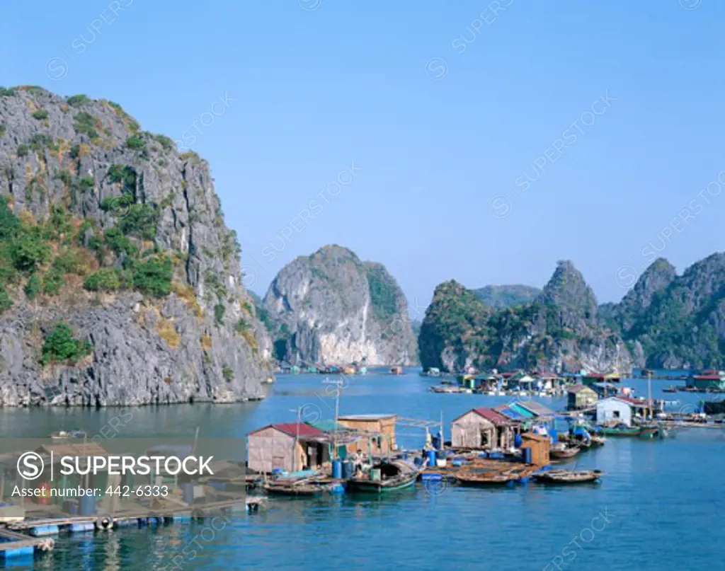 High angle view of houseboats on water, Karst Limestone Rocks, Ha Long Bay, Vietnam