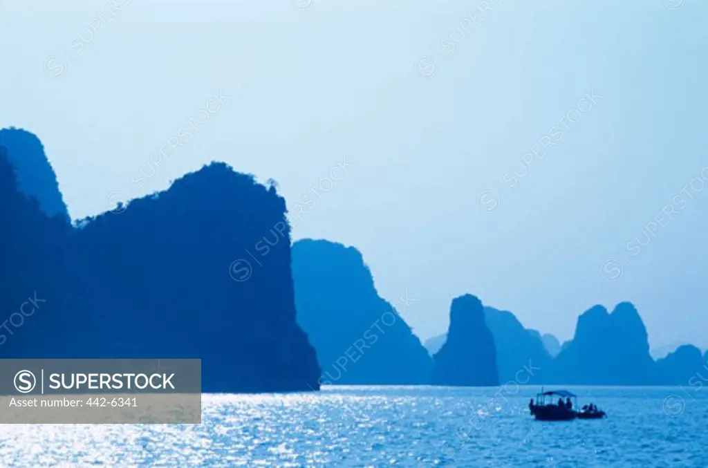 Boat in the water, Karst Limestone Rocks, Ha Long Bay, Vietnam