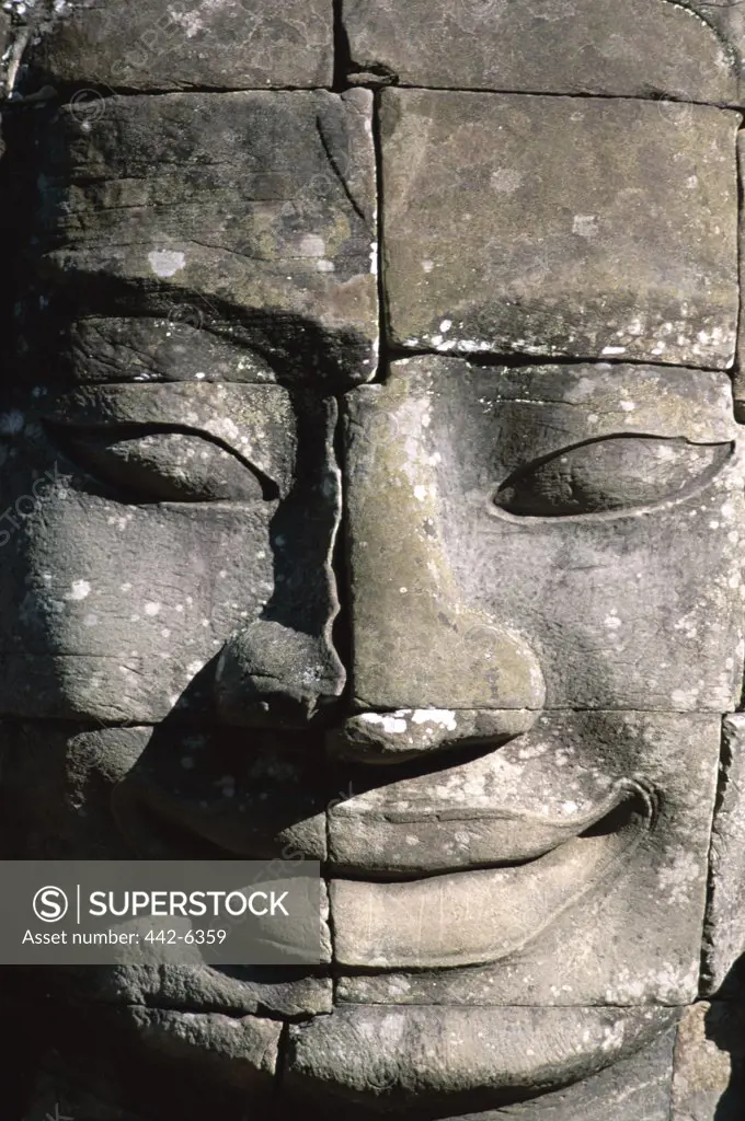 Close-up of the carved face of Lokesvara on a Bayon Temple, Angkor Thom, Siem Reap, Cambodia