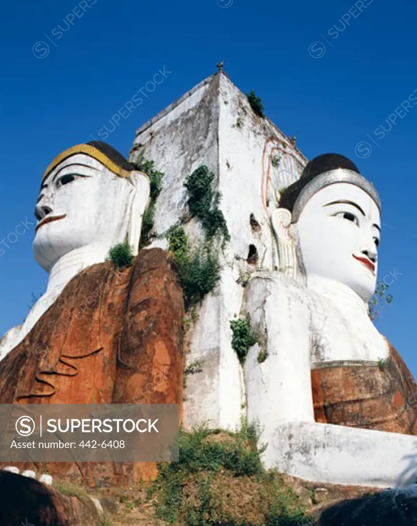 Low angle view of a Buddha statue, Kyaik Pun Paya, Bago (Pegu), Myanmar