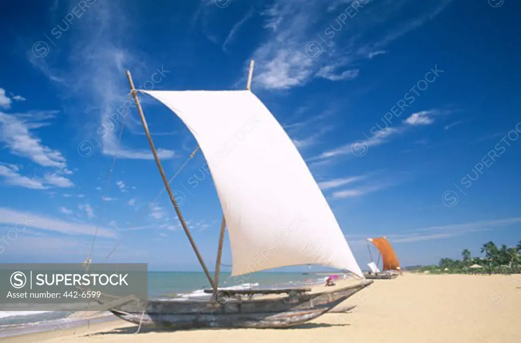 Traditional outrigger fishing boat on the beach, Negombo Beach, Negombo, Sri Lanka
