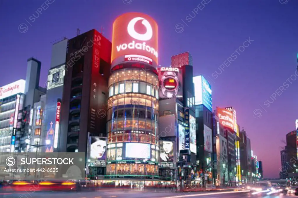 Low angle view of stores illuminated at night, Ginza, Tokyo, Honshu, Japan