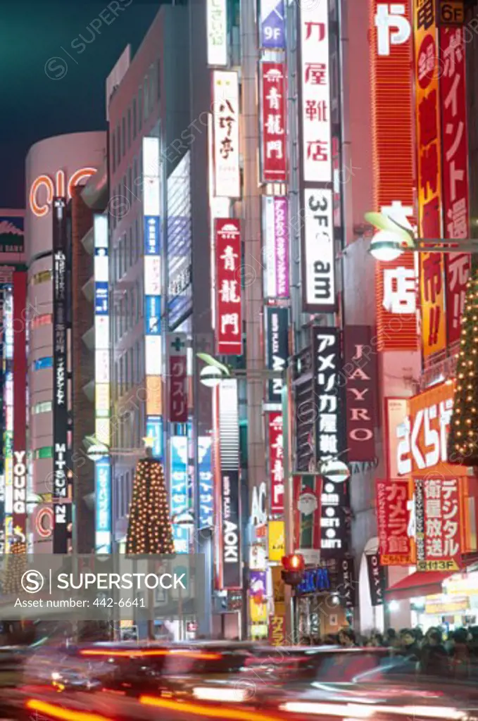 Neon signs in a city, Shinjuku-dori, Shinjuku, Tokyo, Honshu, Japan
