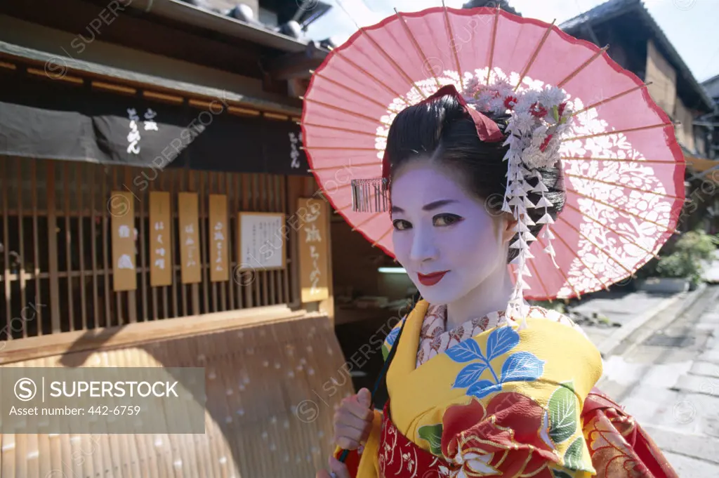 Portrait of a geisha (Maiko) dressed in a kimono, Kyoto, Honshu, Japan