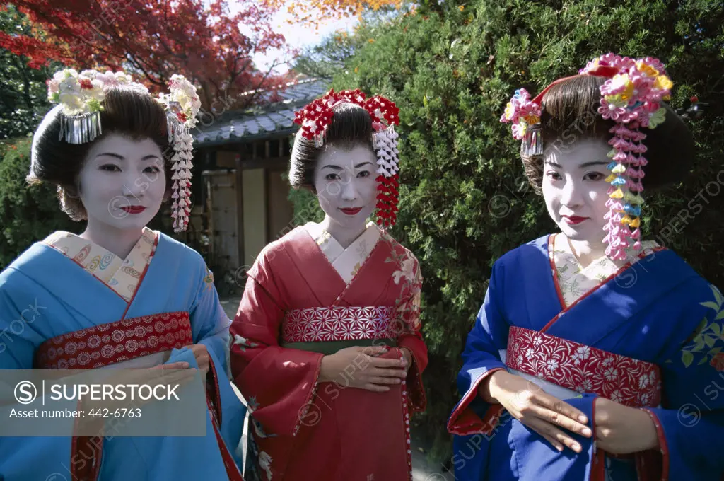 Three geishas (Maiko) dressed in kimonos, Kyoto, Honshu, Japan