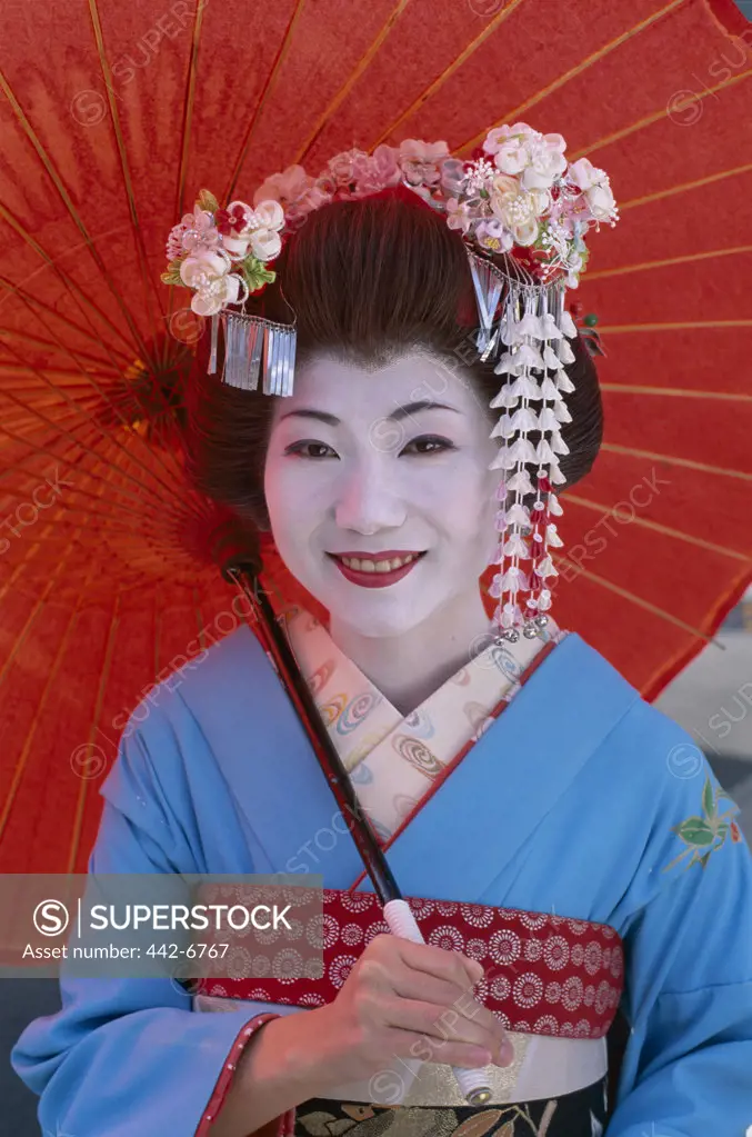 Portrait of a geisha (Maiko) dressed in a kimono, Kyoto, Honshu, Japan