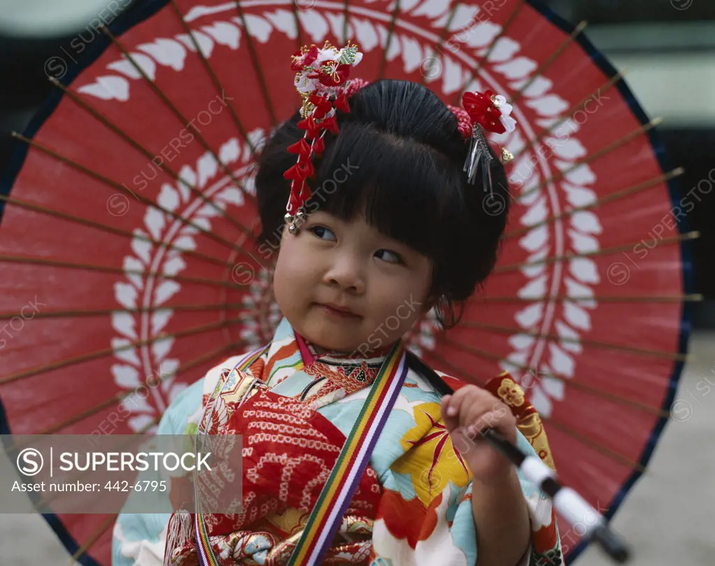 Close-up of a girl at the Shichi-go-san Festival dressed in a kimono, Tokyo, Honshu, Japan