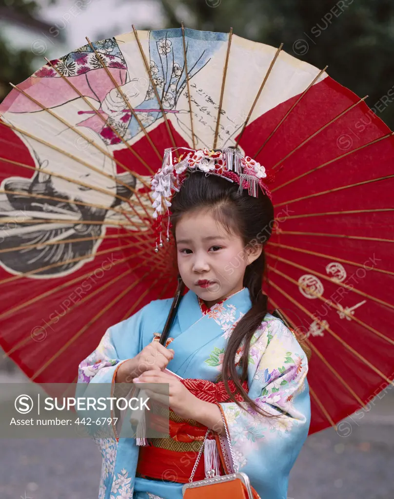 Portrait of a girl at the Shichi-go-san Festival dressed in a kimono, Tokyo, Honshu, Japan