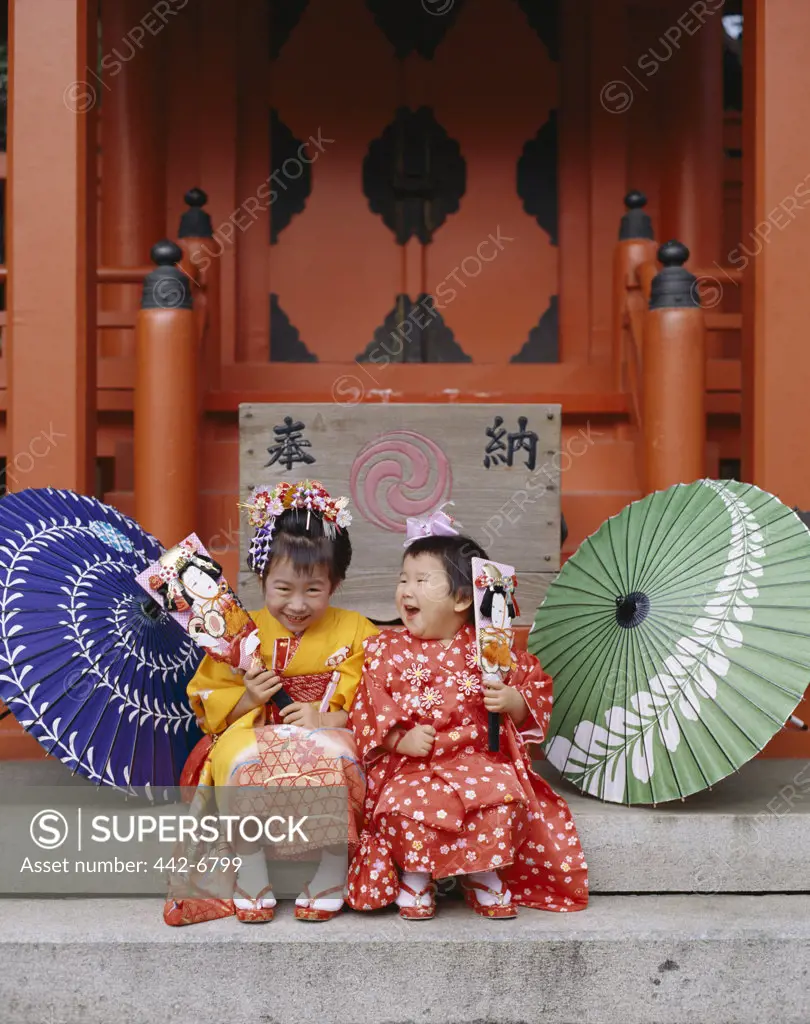 Two girls at the Shichi-go-san Festival dressed in kimonos, Tokyo, Honshu, Japan