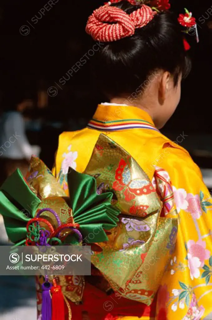 Rear view of a teenage girl dressed in a kimono, Japan
