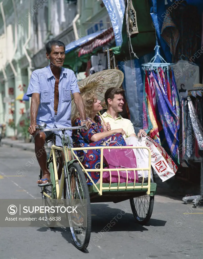 Tourists in a rickshaw, Chinatown, Singapore
