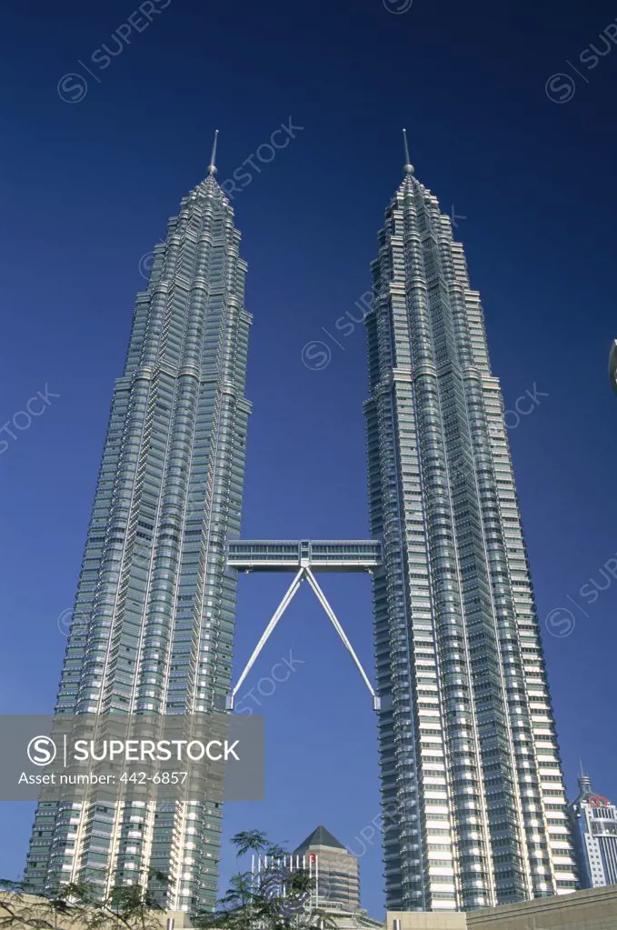 Low angle view of towers, Petronas Towers, Kuala Lumpur, Malaysia