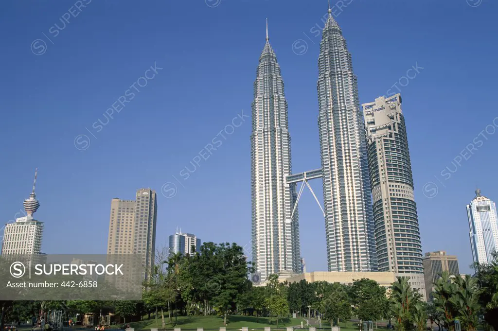 Low angle view of towers, Petronas Towers, Kuala Lumpur, Malaysia