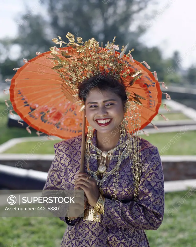 Portrait of a young woman dressed in traditional Malay costumes, Penang, Malaysia