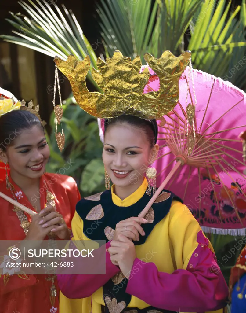 Portrait of two teenage girls dressed in traditional Malay costumes, Penang Cultural Center, Penang, Malaysia