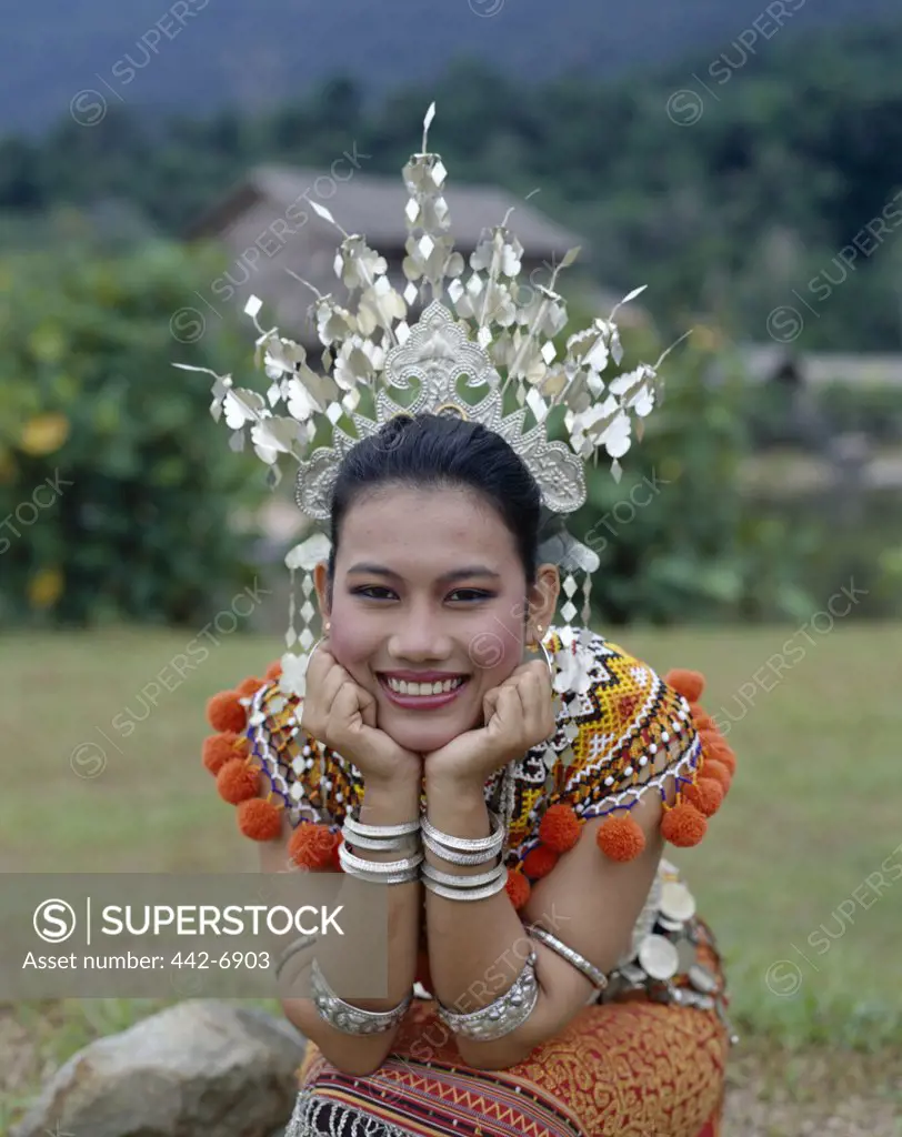 Portrait of a young Iban woman dressed in a traditional costume, Sarawak, Malaysia