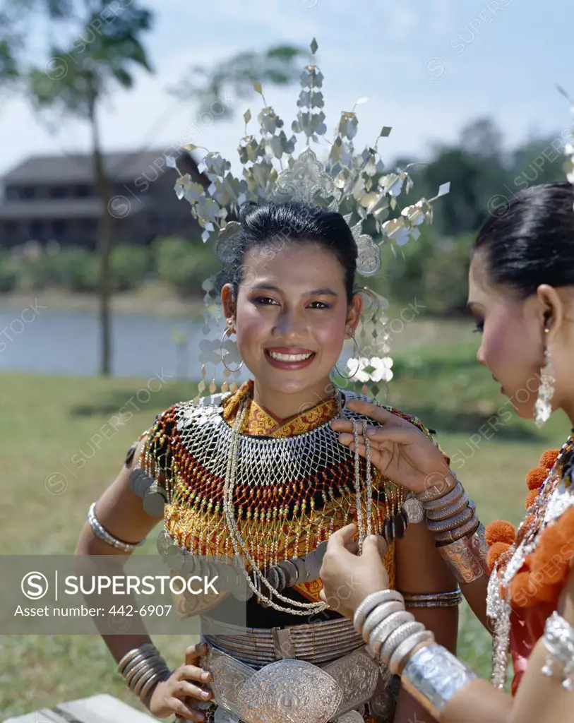 Two Iban women dressed in traditional costumes, Sarawak Cultural Village, Sarawak, Malaysia
