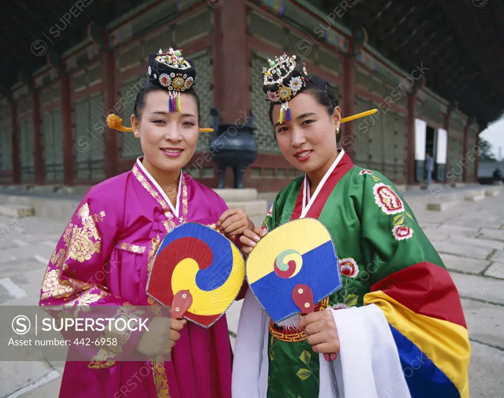 Portrait of two women dressed in traditional costumes, Seoul, South Korea