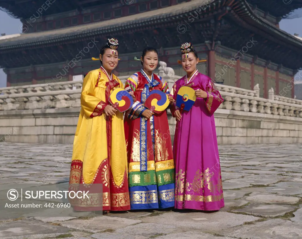 Three young women dressed in traditional folk costumes, Seoul, South Korea