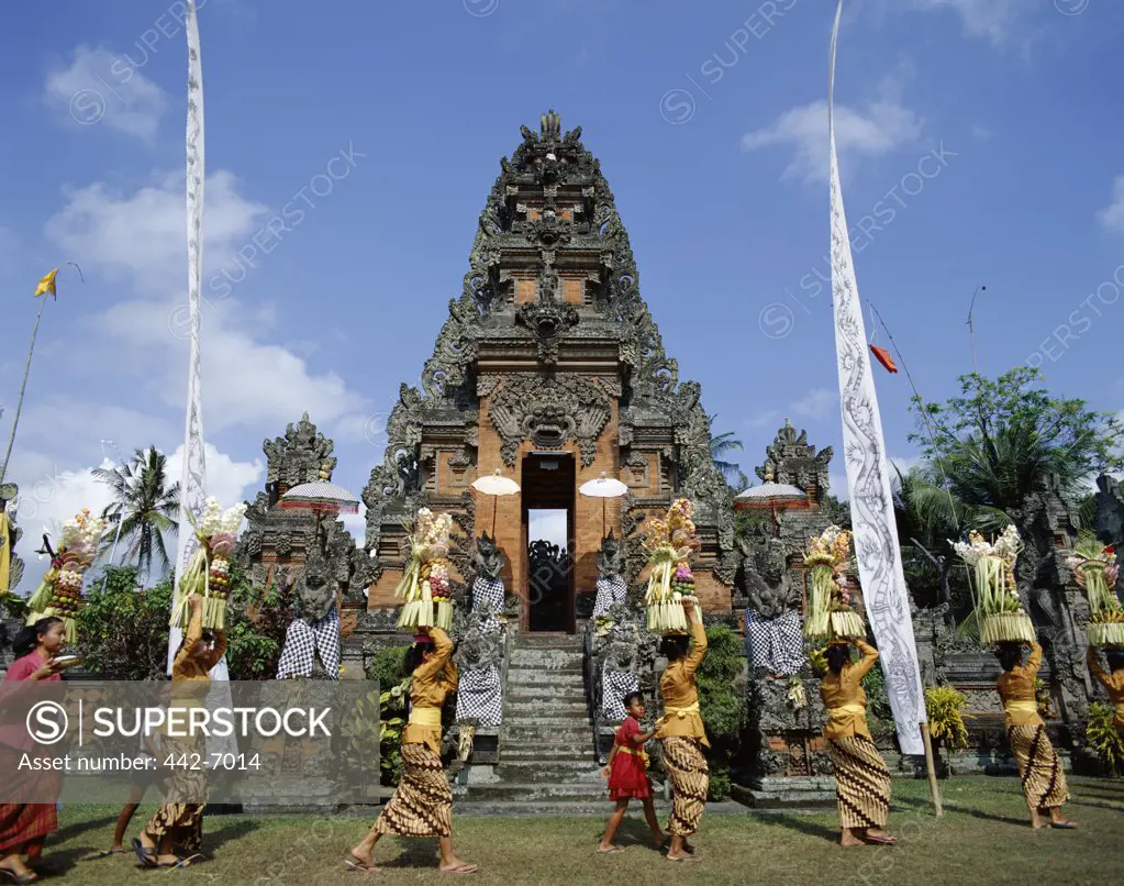 Group of women carrying offerings to a temple festival (Odalan), Bali, Indonesia