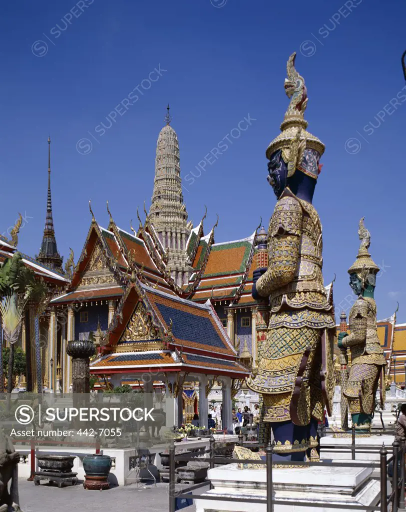 Statues at a temple, Wat Phra Kaeo (Temple of the Emerald Buddha), Bangkok, Thailand