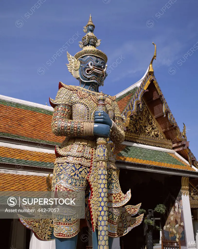 Low angle view of a Ramakien statue, Wat Phra Kaeo (Temple of the Emerald Buddha), Bangkok, Thailand