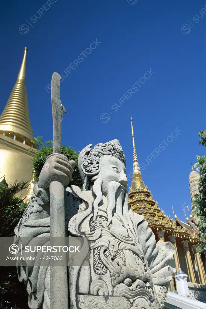 Low angle view of a statue of the Chinese guard, Wat Phra Kaeo (Temple of the Emerald Buddha), Bangkok, Thailand