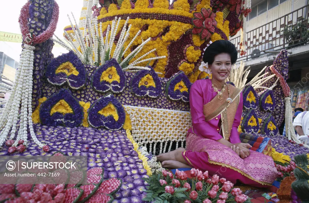 Portrait of a young woman dressed in a traditional Thai costume, Floral Floats, Flower Festival, Chiang Mai, Golden Triangle, Thailand
