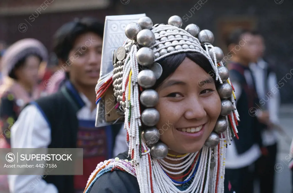 Mid adult woman wearing an ornate headdress, Akha Tribe, Chiang Mai, Golden Triangle, Thailand