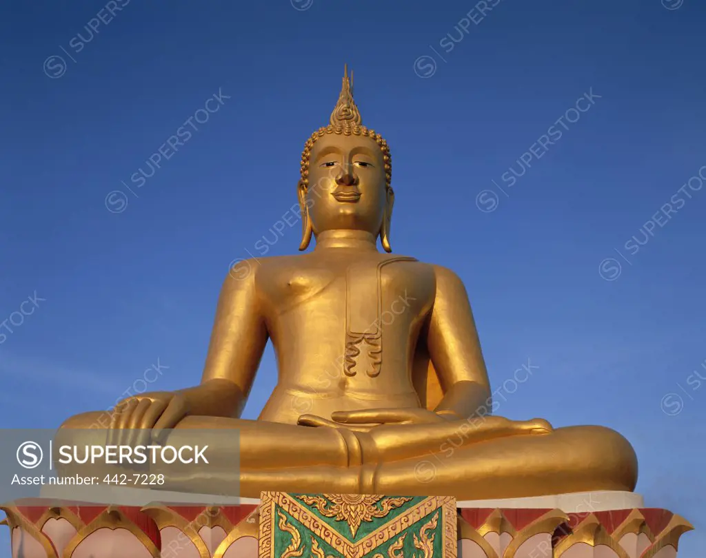 Low angle view of a gold Buddha statue, Big Buddha, Ko Faan, Ko Samui, Thailand