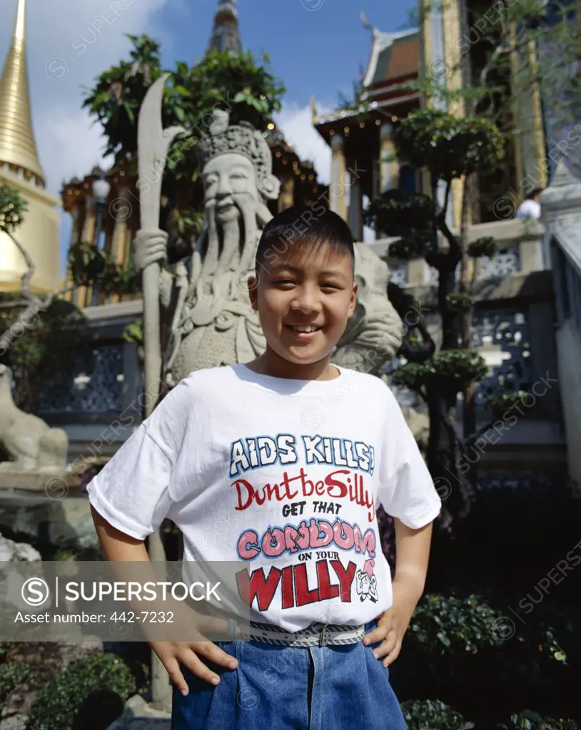 Portrait of a teenage boy wearing an AIDS awareness t-shirt, Thailand