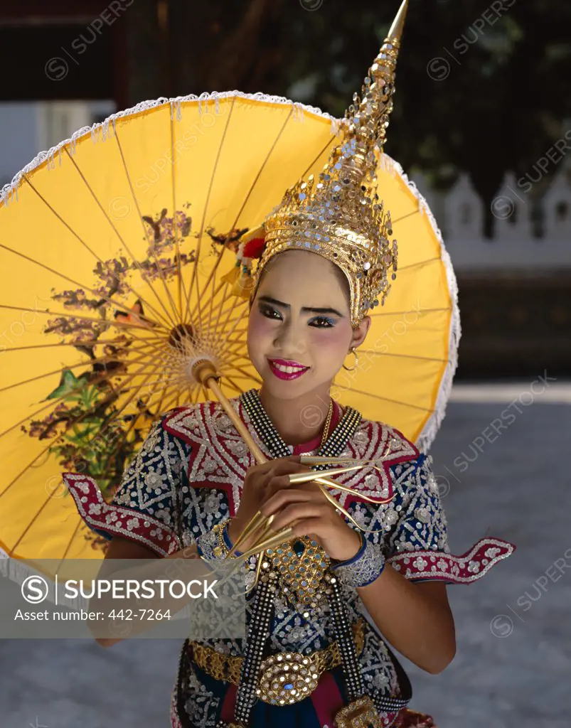 Portrait of a teenage girl dressed in a traditional dancing costume, Bangkok, Thailand