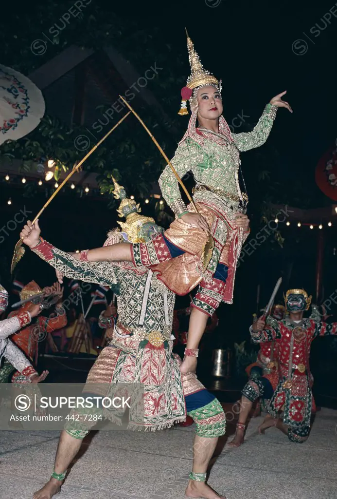Lakhon and Khon dancers dressed in traditional costumes performing a classical dance, Bangkok, Thailand