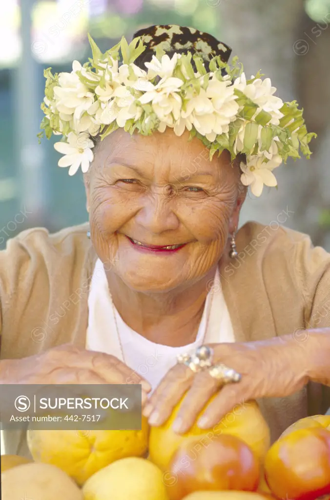 Portrait of a senior woman selling fruits at a market, Punanga Nui Market Rarotonga, Cook Islands, Polynesia