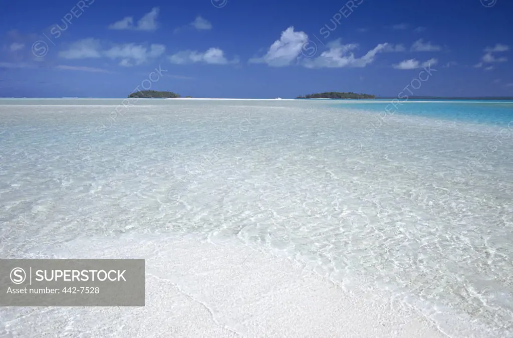 Small island across the water of Aitutaki Lagoon, Aitutaki Island, Cook Islands, Polynesia