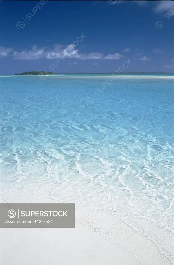 Small island across the water of Aitutaki Lagoon, Aitutaki Island, Cook Islands, Polynesia