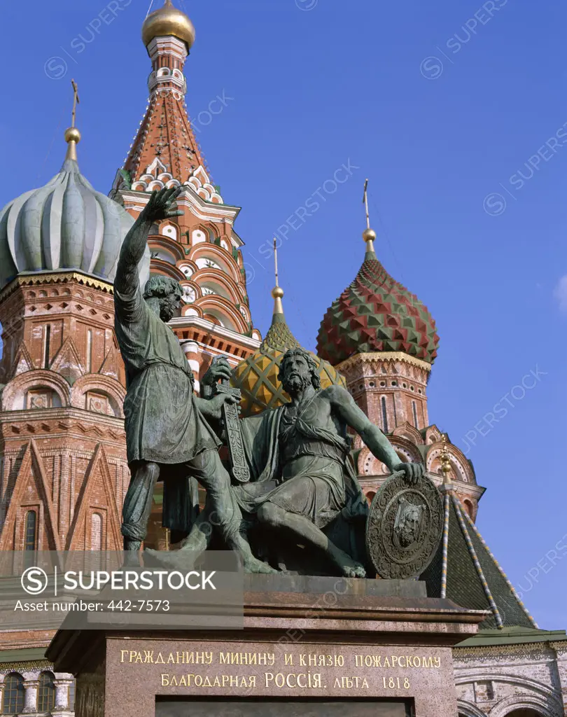 Low angle view of the Minin and Pozharsky Monument with St. Basil's Cathedral, Red Square, Moscow, Russia