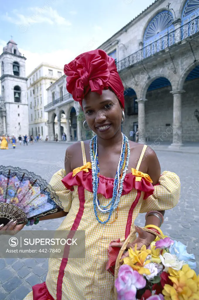 Portrait of a young woman dressed in a traditional colonial costume, Havana, Cuba