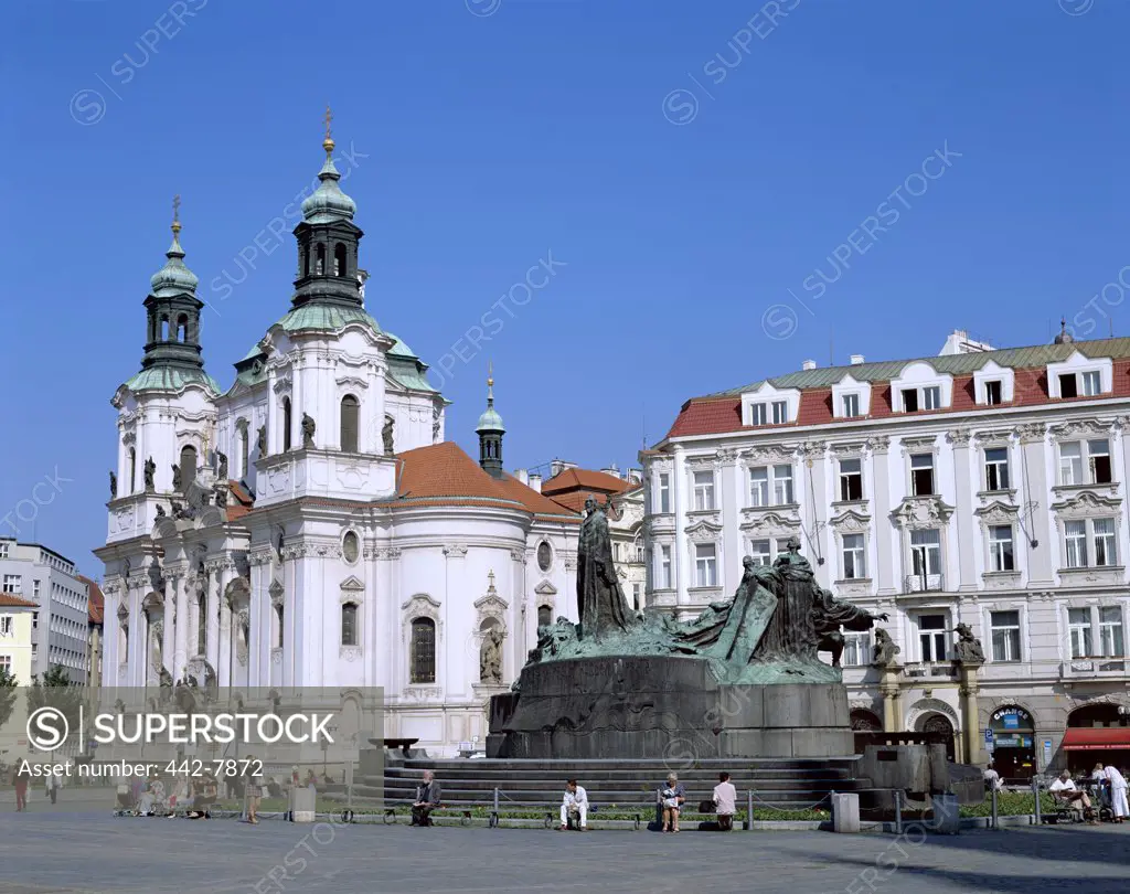 People in front of the Jan Hus Monument and St. Nicholas Church, Old Town Square, Prague, Czech Republic